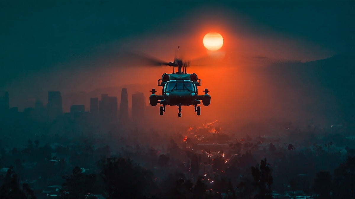 A Black Hawk helicopter centered over a hazy city at sunset